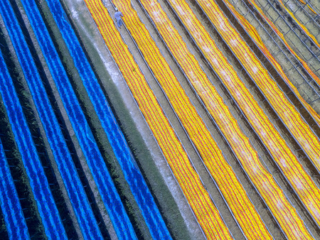 Colorful fabric hanging to dry view from above