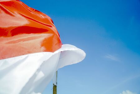 Indonesian flag with blue sky background, Merah Putih on Indonesian independence day