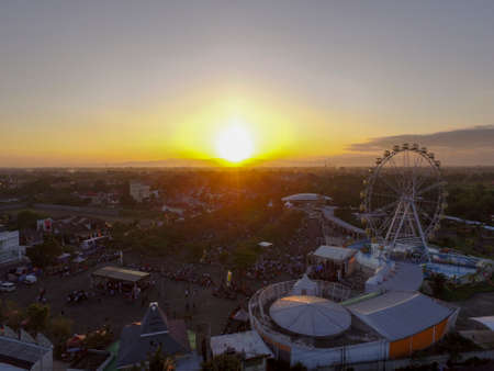 Yogyakarta Indonesia April 11 2020 : Ferris wheel, Big Wheel in Yogyakarta at twilight time and beautiful sky. Big Ferris Wheel at Sunset. Taman Sindu Parkのeditorial素材