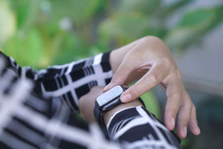 Bali Indonesia June 2 , 2020 : Apple Watch Series 5 Ready to work out on woman's hand. Woman using smart watchのeditorial素材