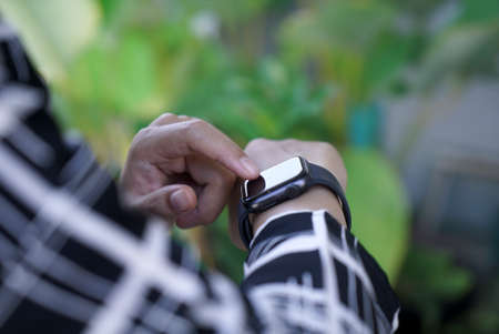 Bali Indonesia June 2 , 2020 : Woman using smart watchのeditorial素材