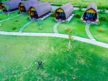 Bali Indonesia June 21, 2020 : Man selfie with drone in green fieldのeditorial素材