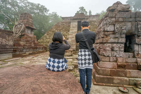 Indonesia June 17, 2020 : Tourist enjoying Cetho Temple in the morning, Hindu Temple in Karanganyar, Central Java Indonesiaのeditorial素材