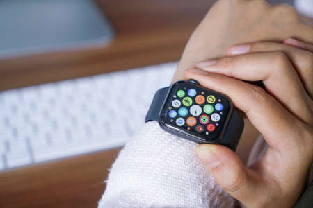 Bali Indonesia June 12, 2020 : female hands using with apple, Apple Watch is a line of smartwatches designed, developed, and marketed by Apple Inc.のeditorial素材