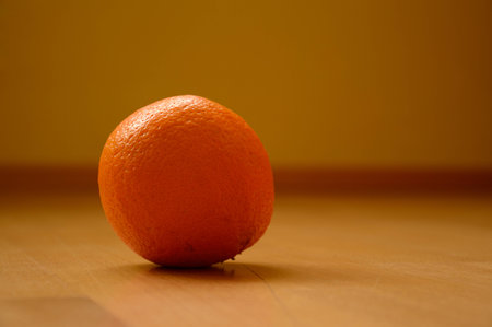Orange on the wooden tableの写真素材