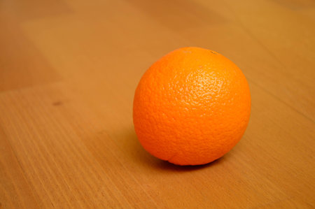 Orange on the wooden tableの写真素材