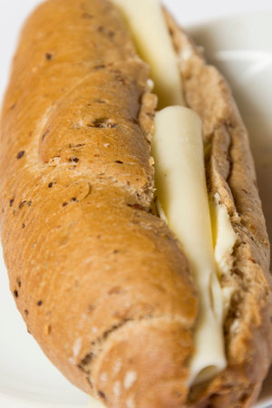 Roll bread with butter and cheese for breakfastの写真素材