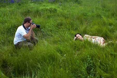 young family on a walk in the park on sunny dayの写真素材