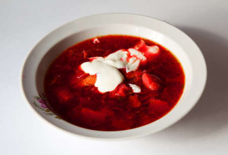 plate with fresh hot vegetable soup on the table