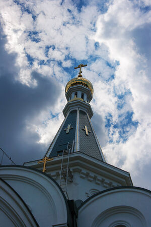 dome of the Church of St. Alexander Nevsky with dark clouds on summerの写真素材
