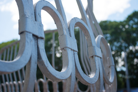 fragment of white metal grating on sunny day. geometric pattern closeupの写真素材