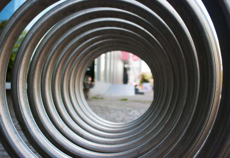 front view of large metal spiral as an abstract background outsideの写真素材