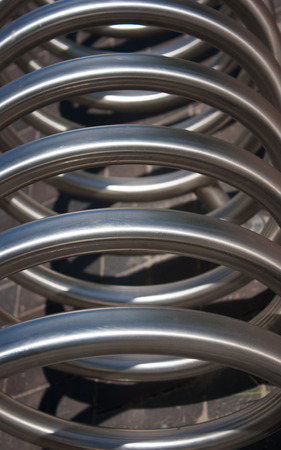 large metal spiral as an abstract background closeup outsideの写真素材