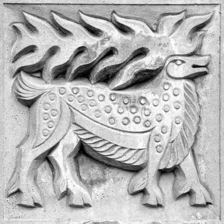 fabulous moose, a stone bas-relief on the wallの写真素材