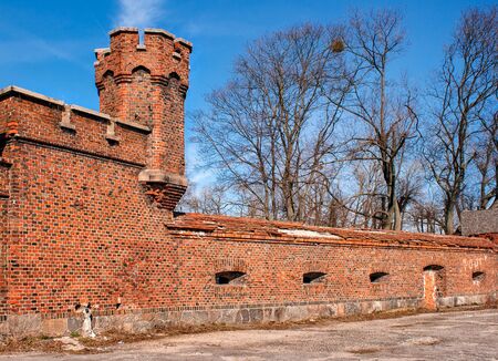 tower and brick wall of the old fortress on sunny spring dayの写真素材