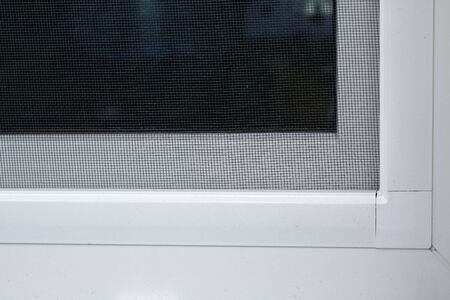 plastic window with mosquito net outdoor detail closeupの写真素材