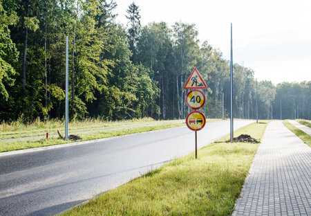 road signs on the new road on sunny summer dayの写真素材
