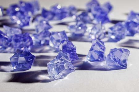 blue glass crystals on the table indoor closeupの写真素材