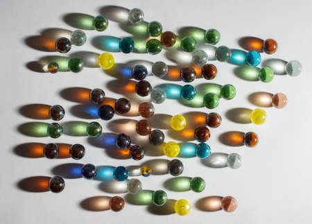 multicolored glass balls on the table indoor closeup