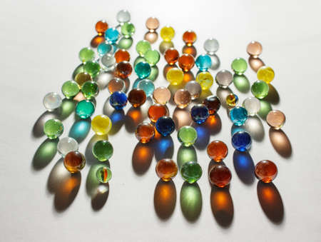 multicolored glass balls on the table indoor closeupの写真素材