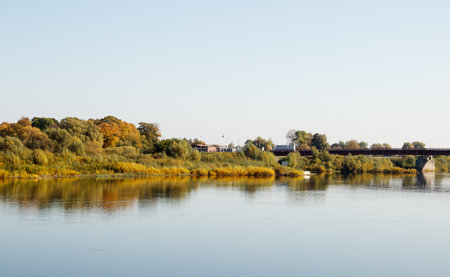 small town by the river on sunny autumn day