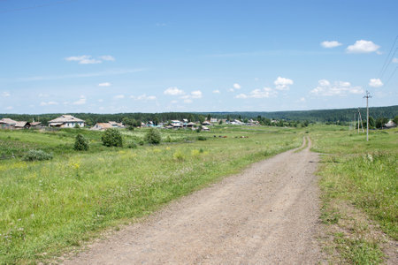 dirt road in siberian village on sunny summer dayの写真素材