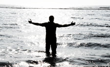 Sad boy in Ocean - feeling relaxの写真素材