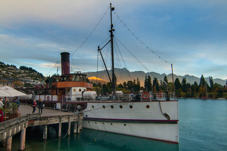 Queenstown on the sunset with steamship and mountains, New Zealand South Islandの写真素材