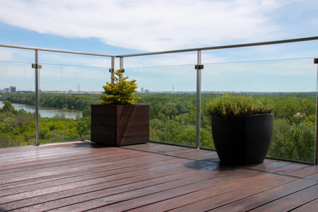 Balcony with grooved cumaru decking, extrerior terrace natural view with reeded cumaru hardwood deck structure claddingの写真素材