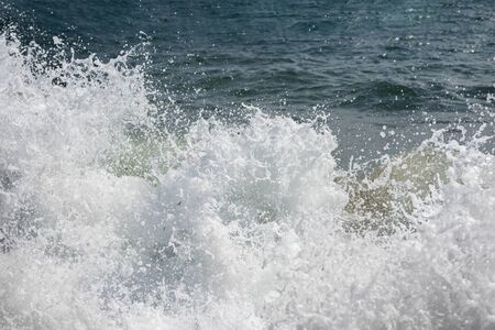 Crashed wave - foam and spray. Mediterranean sea. Tension and struggle conception. Texture.の写真素材