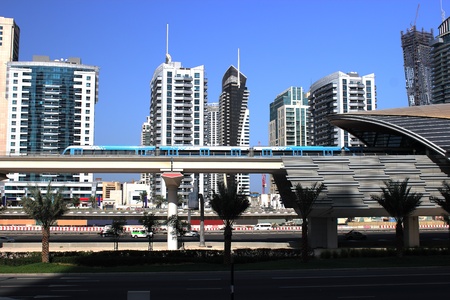 new metro in motion departure from station jumeirah lake towersのeditorial素材