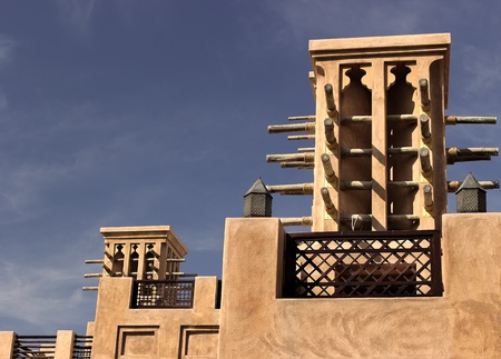 old wind towers in dubai with clear blue skyの写真素材