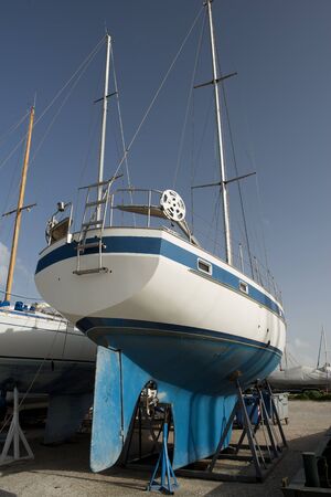 blue boat on dock for maintaines.