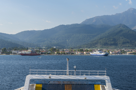 Ferry boat in the sea, back view,Aproaching Tasos islandの写真素材