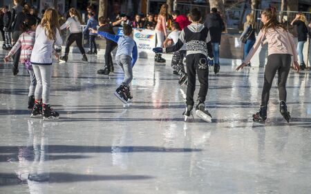 Burgas, Bulgaria - December 09, 2017: hapy kids and teenagers enjoying on scating rink, days before cristmasのeditorial素材
