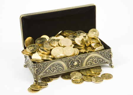 gold casket and gold coins on a white backgroundの写真素材