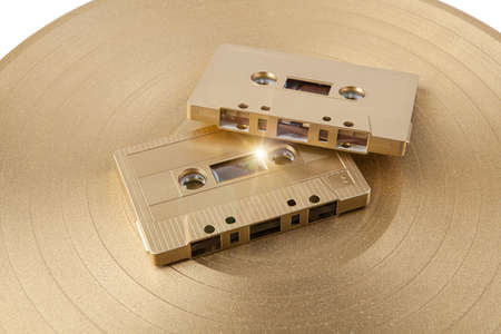 A golden cassette tape on the white backgroundの写真素材