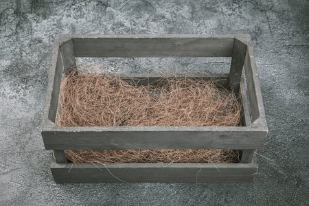 Wooden box with grass on cement background. top view. copy space.の写真素材