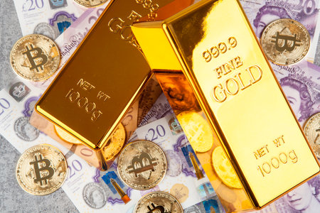 Gold bullion and gold ingots on the background of money.