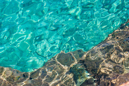 Blue sea, rocks underwaterの写真素材