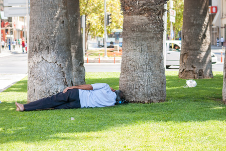Man sleeping in a parkの写真素材