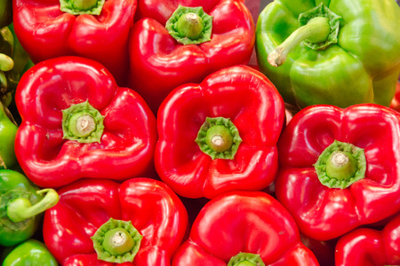 Pile of red and green peppersの写真素材