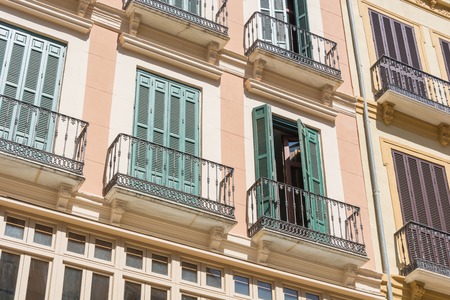 Old tenement house decorative windowsの写真素材