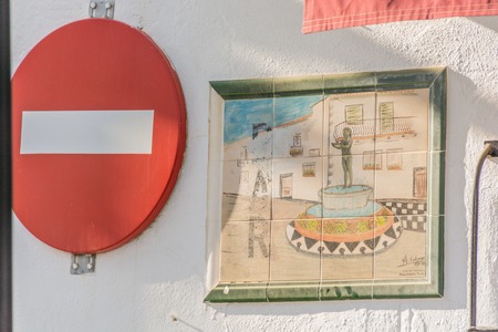 BENALMADENA, SPAIN - Decorative tiles on a white wallの写真素材