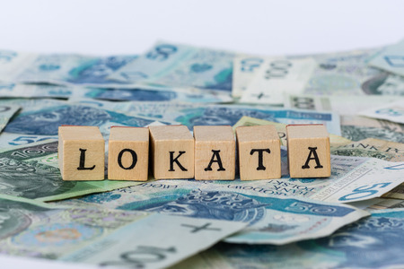Word investment written on wooden blocks on polish money, "lokata" means "investment"の写真素材