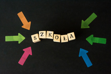 Word school written with wooden blocks, "szkoÅa" means school in polishの写真素材