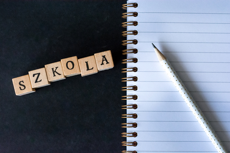 Word school written with wooden blocks, "szkoÅa" means school in polishの写真素材