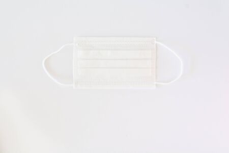 Surgical protection mask to cover mouth and nose flat lay concept photoの写真素材