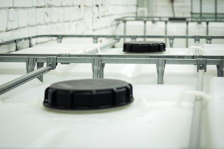 Large plastic fuel containers in warehouseの写真素材