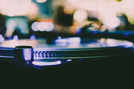 DJ vinyl players in dark nightclub, party in the dance club